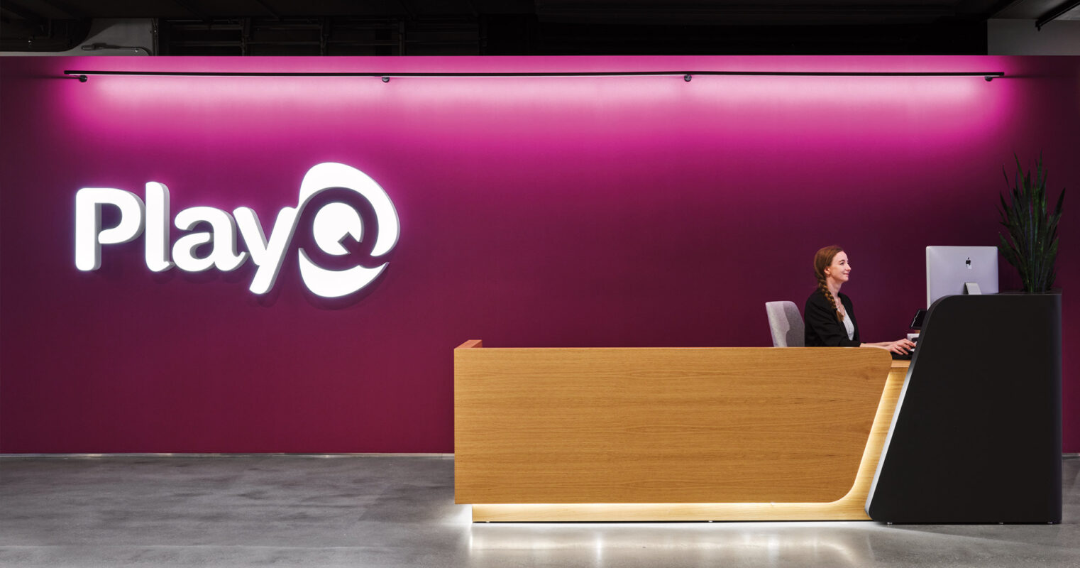 Reception desk with bright logo sign
