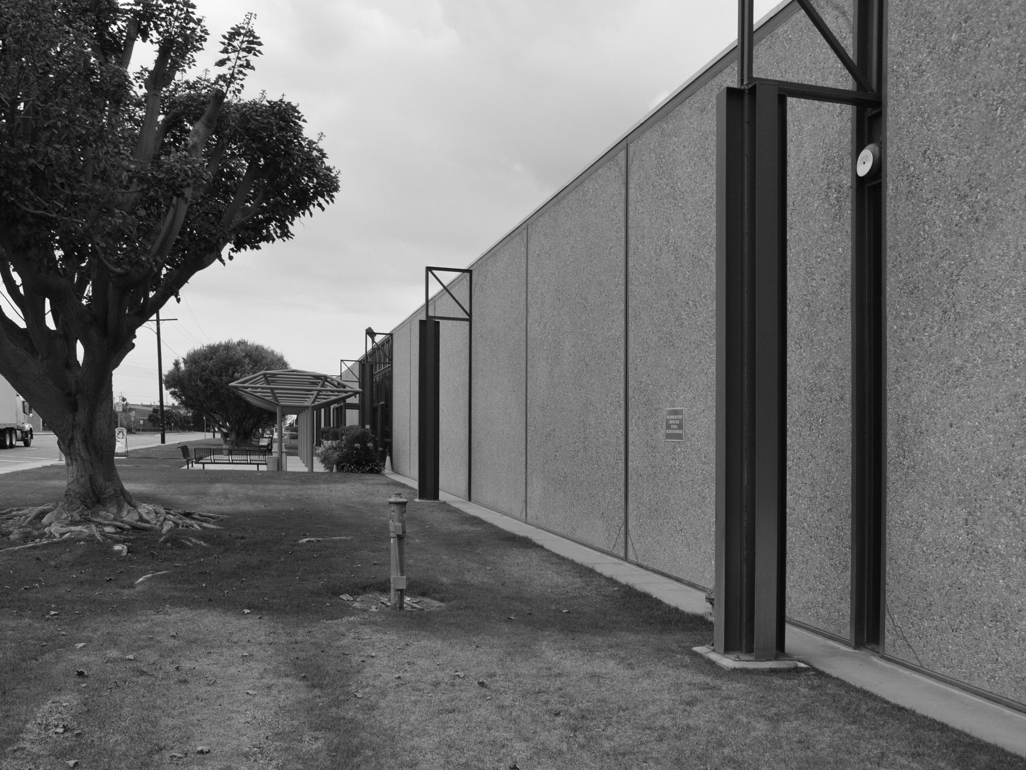 Concrete exterior of former Xerox facility in black and white.
