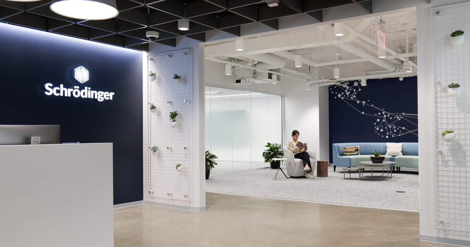 The interior of a modern office space adorned with vibrant wall art. The artwork combines creativity and professionalism, creating an inspiring environment for work.