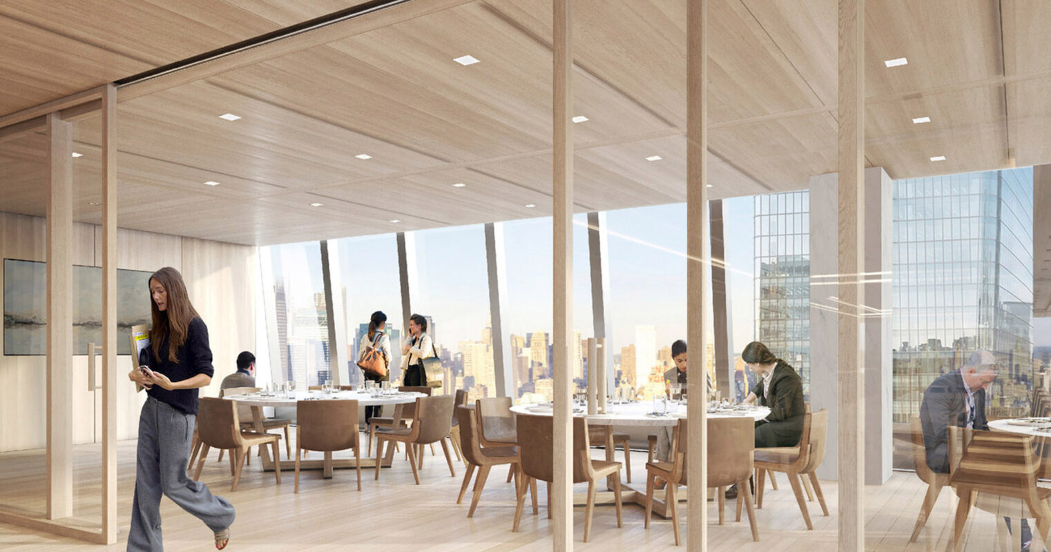 Spacious dining area featuring floor-to-ceiling glass partitions, bathed in natural light with panoramic city views. Contemporary wooden furniture and light hardwood floors complement the room's warm, neutral palette.
