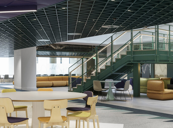 A contemporary open-plan interior showcasing a vibrant lounge area with green and gold accents. The design features a modern staircase leading to elevated seating areas, complemented by colorful chairs and a mixed-use table. Sleek geometric ceilings enhance the space, promoting a collaborative and inviting atmosphere.