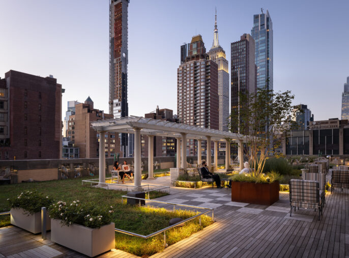 A contemporary rooftop garden features sleek wooden decking, integrated seating, and lush planters, offering a serene urban oasis. Backlit by subtle landscape lighting, the design showcases a harmonious blend of greenery and city skyline, highlighting modern architecture, relaxation zones, and stunning evening views of skyscrapers.