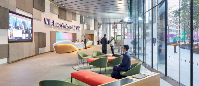 Modern corporate lobby featuring a curved reception desk, sleek glass walls, and an array of colorful seating options set on a polished concrete floor, accentuated by natural light and digital display screens.