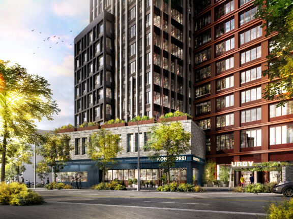 Modern mixed-use development rendering featuring a street-level commercial space with sleek glass facades beneath residential buildings of contrasting red brick and dark metal cladding. Lush green planters add a touch of nature to the urban environment.