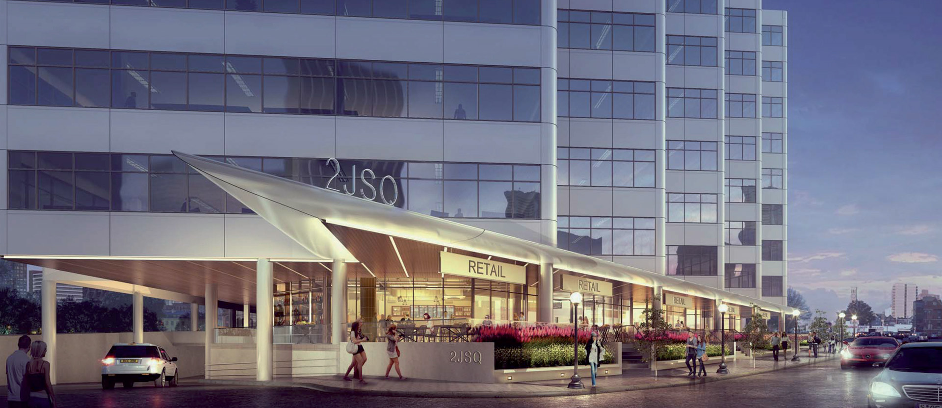 Contemporary glass building facade at dusk, featuring staggered rectilinear forms, reflective windows, and integrated retail space beneath an illuminated angled marquee.