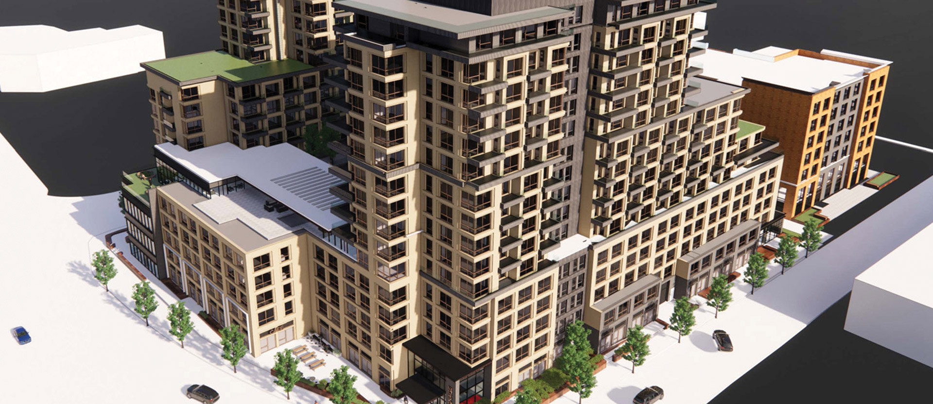 Aerial view of a modern multi-story residential building with mixed-material facade, expansive balconies, and integrated green spaces, surrounded by water on a clear day.