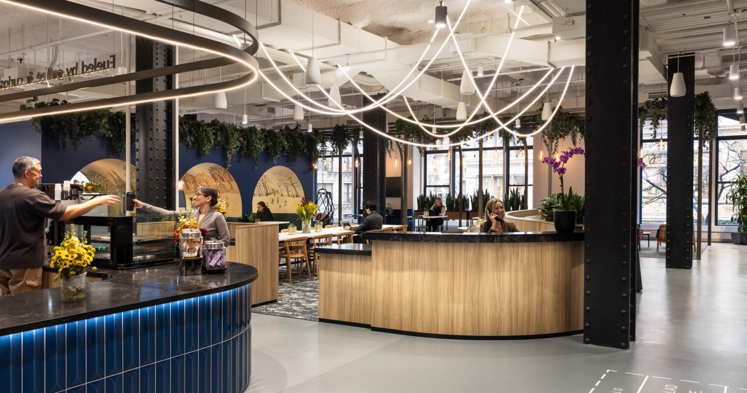 A modern café interior featuring a spacious layout with open seating and large windows creating an inviting atmosphere. Unique design elements include organic shapes in wood furnishings, ambient lighting with sculptural light fixtures, and vibrant greenery integrated into the decor, enhancing both aesthetics and air quality.